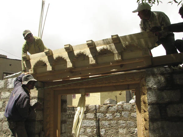 The carved parts of the main door are assembled.
